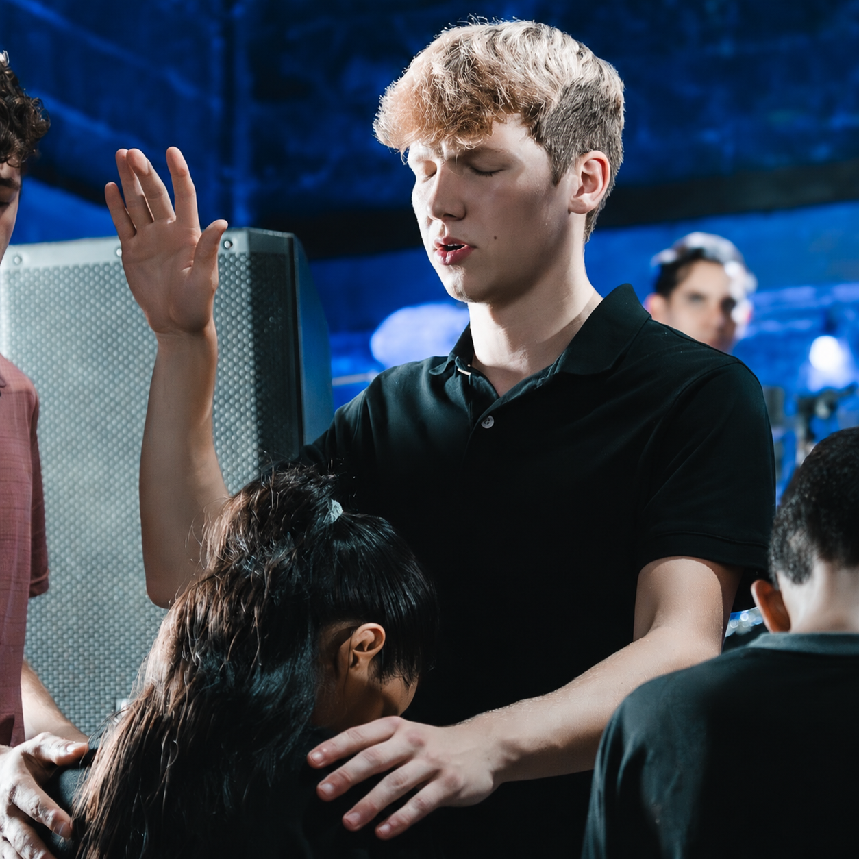 Elijah praying with a student