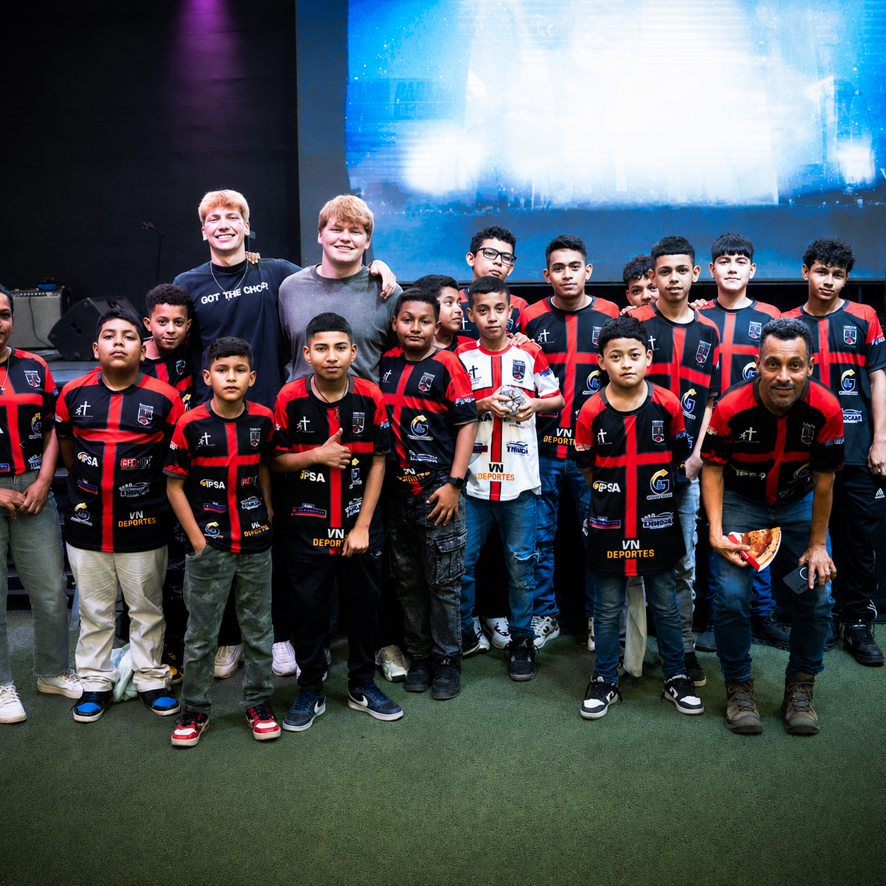 Elijah with a group of young athletes